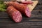 Sausage , gastron delicatessen appetizer foodstuff protein on Ð´ÐµÑ€ÐµÐ²ÑÐ½Ð½Ð¾Ð¼ background sliced gourmet